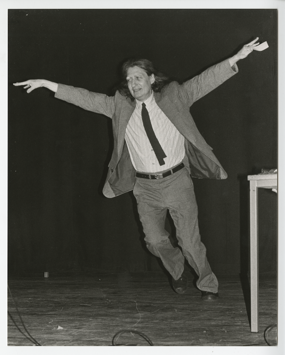 Jackson Mac Low is here "flying" according to the action instructions he is holding in his hand. The photograph was captured in a performance at the Festival of Fantastics at Roskilde, Denmark, in 1985. Reproduced courtesy of the Estate of Jackson Mac Low and Anne Tardos.