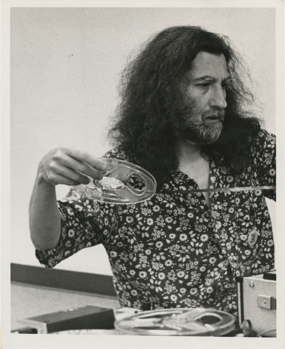 Working on a tape collage at Thomas Jefferson College's first National Poetry Festival, 1971. Grand Valley State College. Photographer unknown. Reproduced courtesy of the Estate of Jackson Mac Low and Anne Tardos.